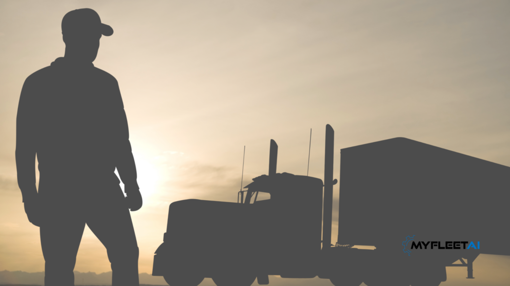 silhouette of a person standing near a semi-truck
