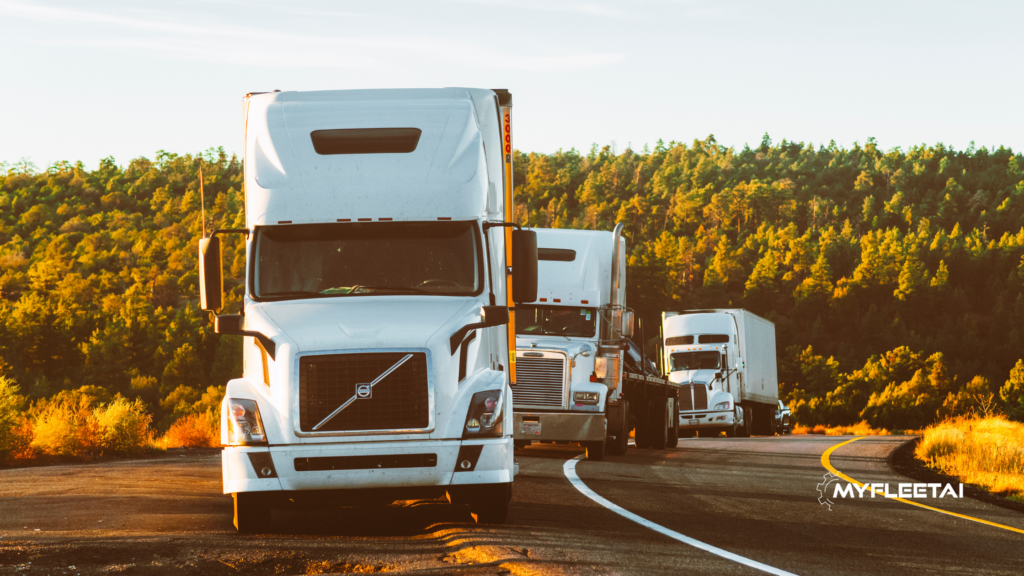 fleet of white semi-trucks parked on the side of the road