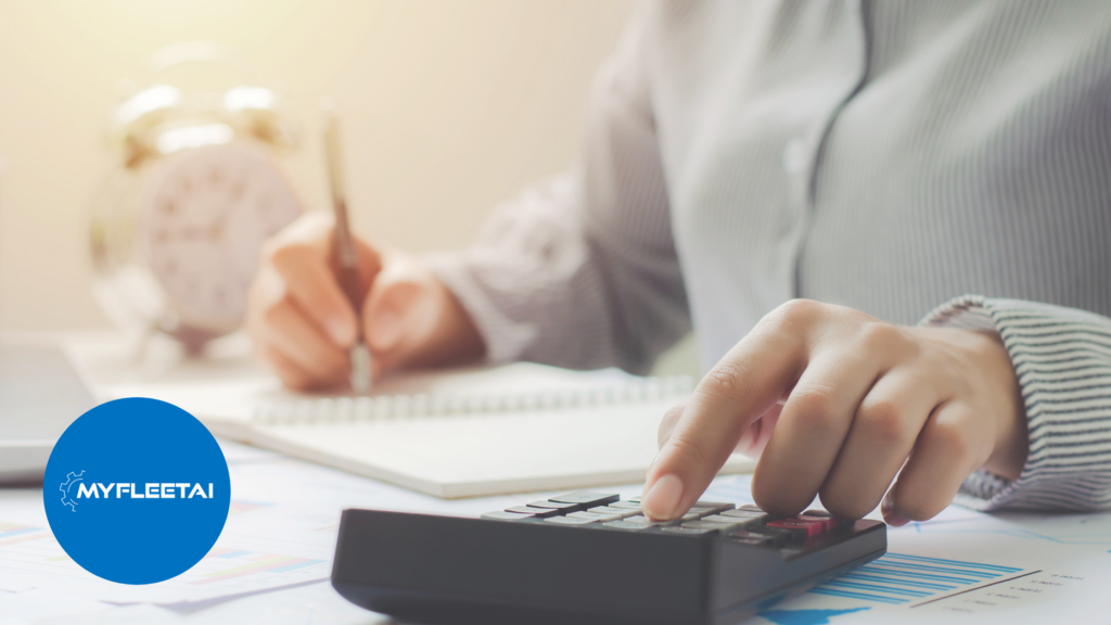 right hand writing in a notebook and left hand using calculator 